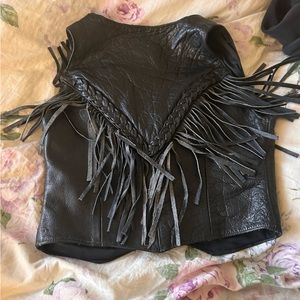 Vintage men’s leather vest tailored to fit a small woman.